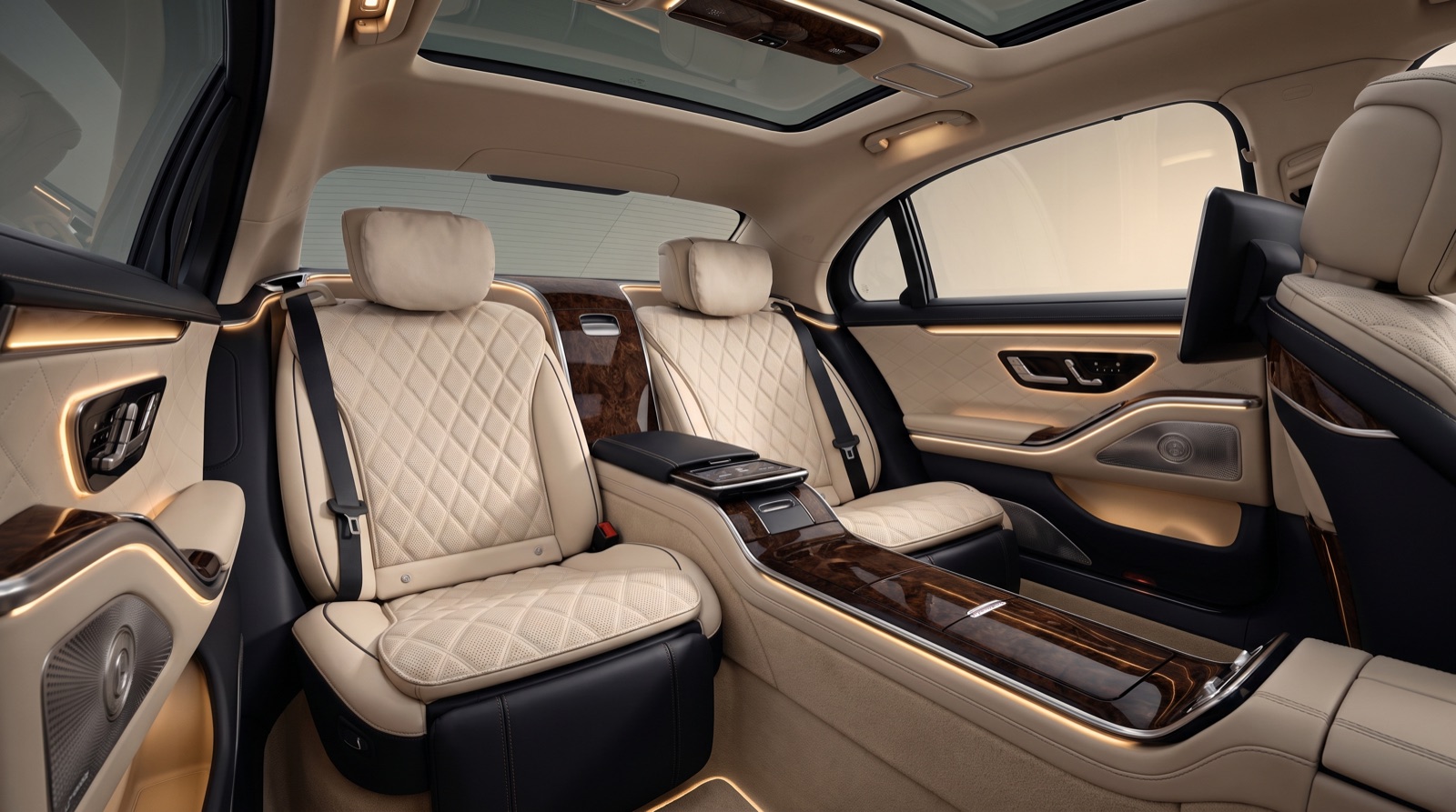 Luxury sedan rear cabin with quilted leather and ambient gold lighting